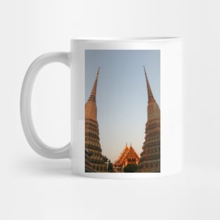 Part view from two stupa against clear sky at Wat Pho Buddha temple. Mug